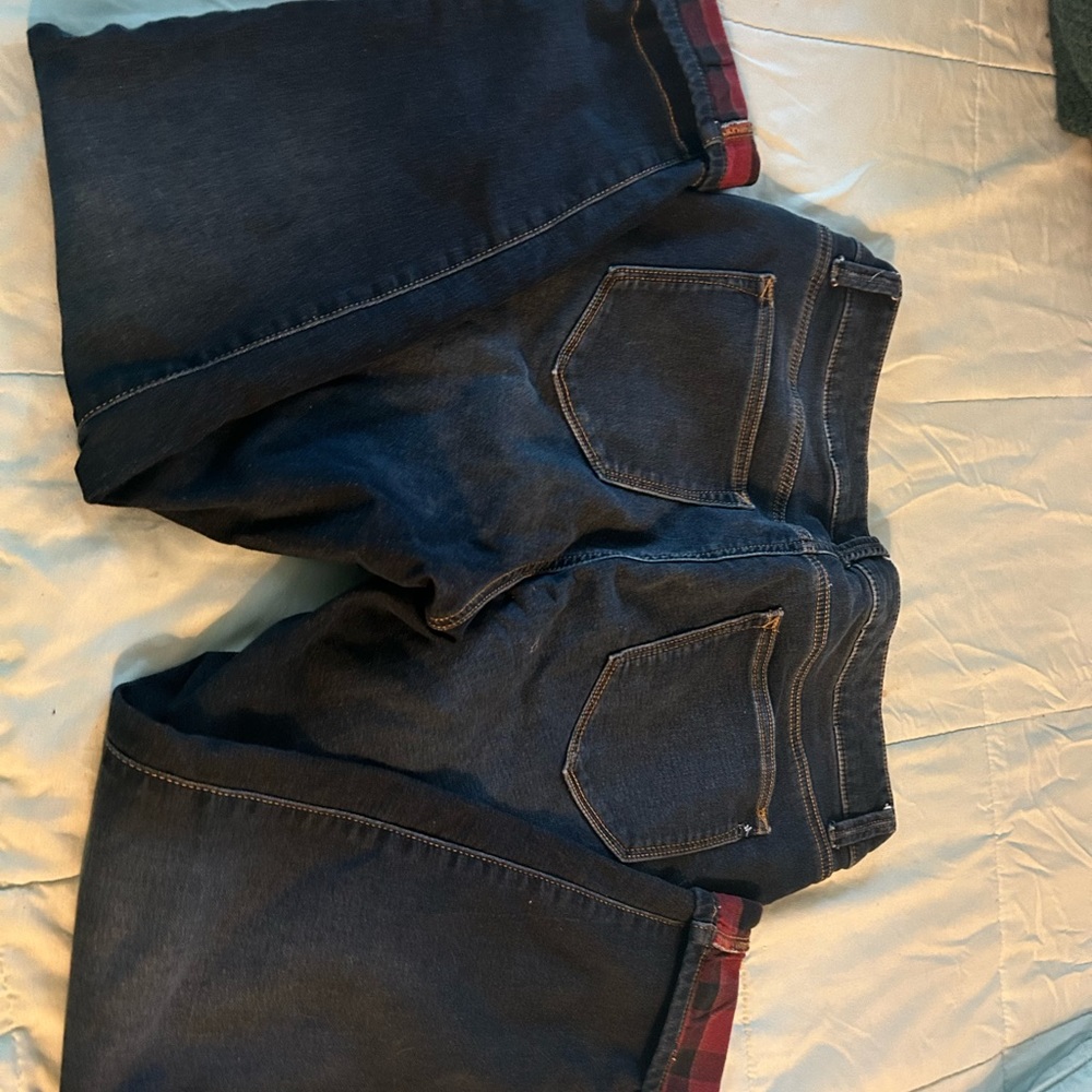Cute dark fitted jeans with red flannel cuff.